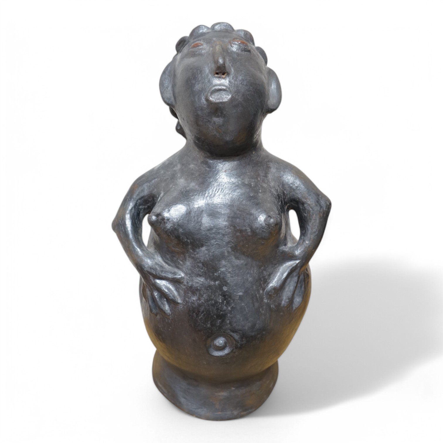 An African clay sculpture of a woman by Jesserina Chamisa, 52cm high. Condition - good